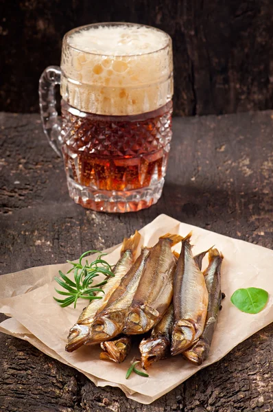 Smoked fish with beer — Stock Photo, Image