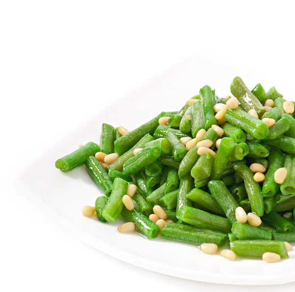 Fried green beans with cedar nuts — Stock Photo, Image