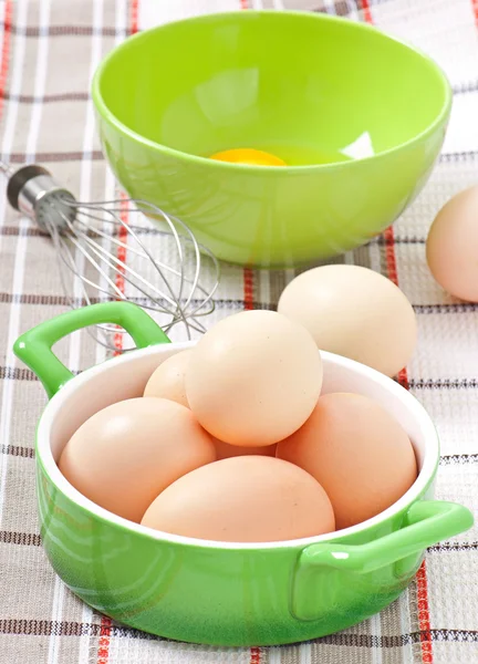 Raw eggs in a saucepan — Stock Photo, Image