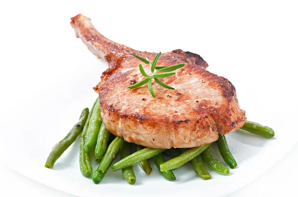 Juicy grilled pork fillet steak with with green beans — Stock Photo, Image
