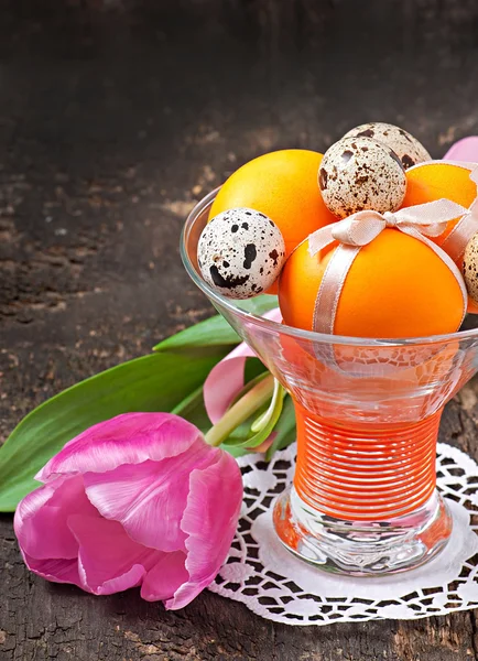 Colorful easter eggs on old wooden background — Stock Photo, Image