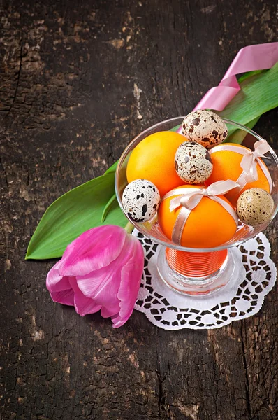 Colorful easter eggs on old wooden background — Stock Photo, Image