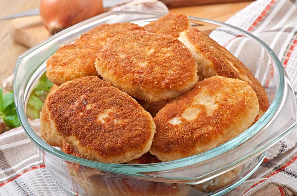 Chicken cutlets in a glass bowl — Stock Photo, Image