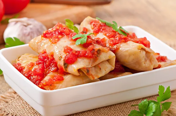 Stuffed cabbage with tomato sauce decorated with parsley — Stock Photo, Image