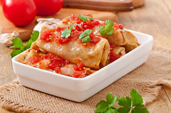 Stuffed cabbage with tomato sauce decorated with parsley — Stock Photo, Image
