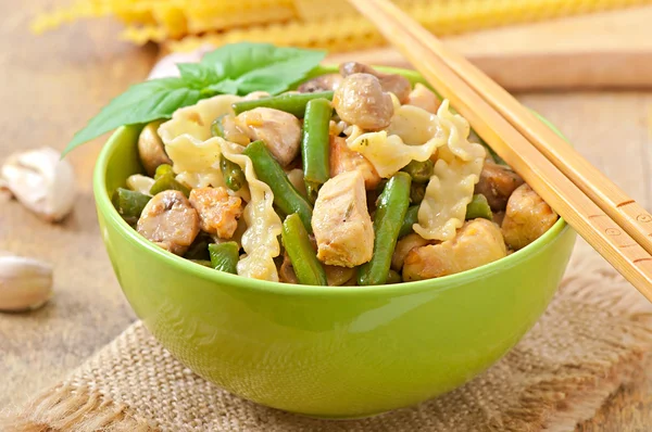 Noodles with meat, beans and mushrooms — Stock Photo, Image