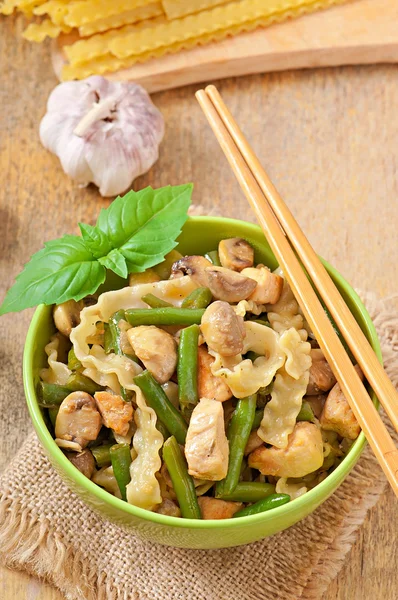 Noodles with meat, beans and mushrooms — Stock Photo, Image
