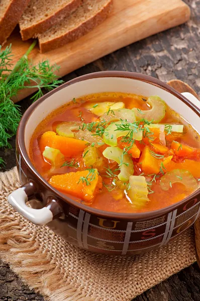 Vegetable soup on the old wooden background — Stock Photo, Image