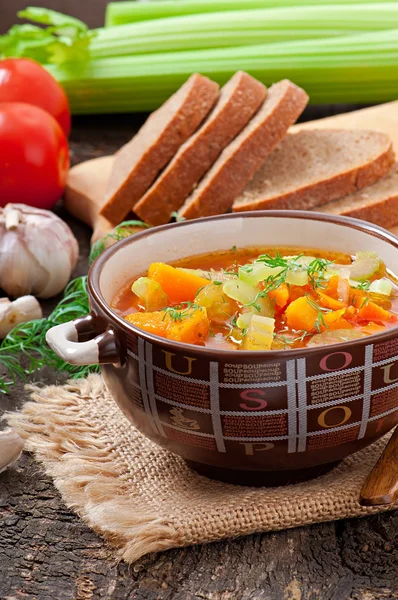 Vegetable soup on the old wooden background — Stock Photo, Image