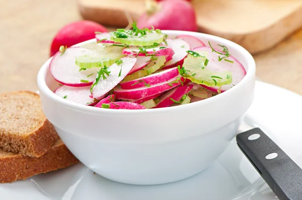 Radish salad in white bowl — Stock Photo, Image
