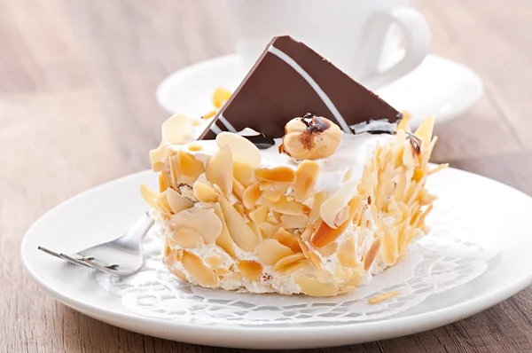 Gentle almond cake with whipped cream and chocolate — Stock Photo, Image