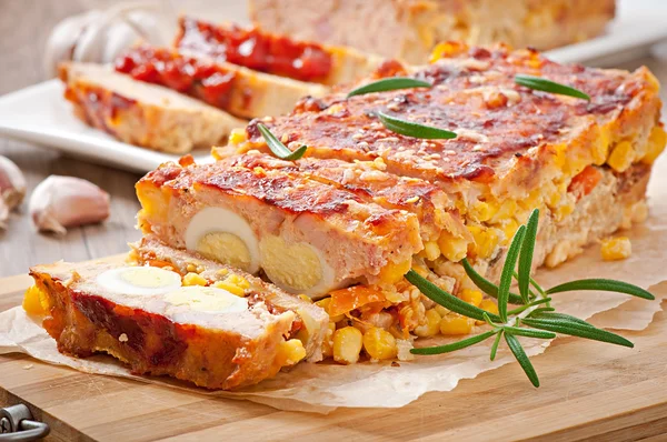 Homemade ground meatloaf with ketchup and rosemary — Stock Photo, Image