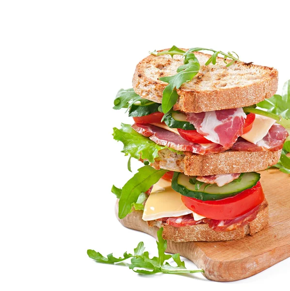 Sandwich with ham, cheese and fresh vegetables on white background — Stock Photo, Image