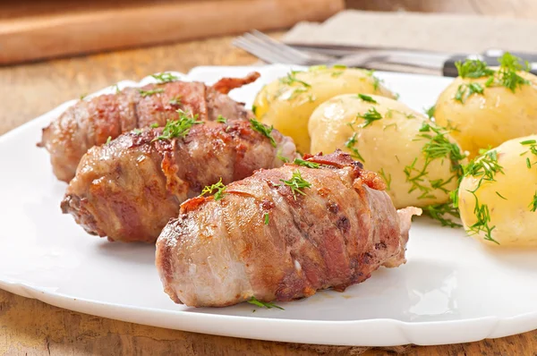 Grilled meat rolls wrapped in strips of bacon — Stock Photo, Image