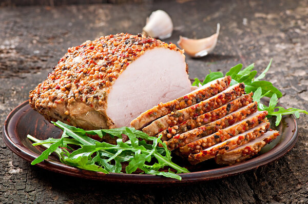 Baked pork  with arugula leaves