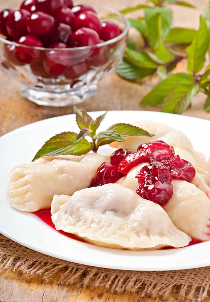 Cherry dumplings with mint — Stock Photo, Image