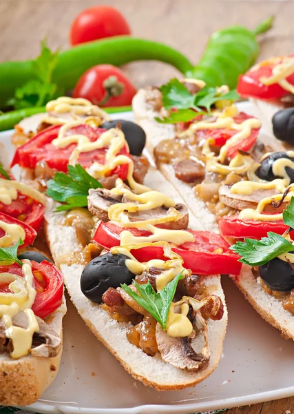 Baguette with veal and mushrooms — Stock Photo, Image