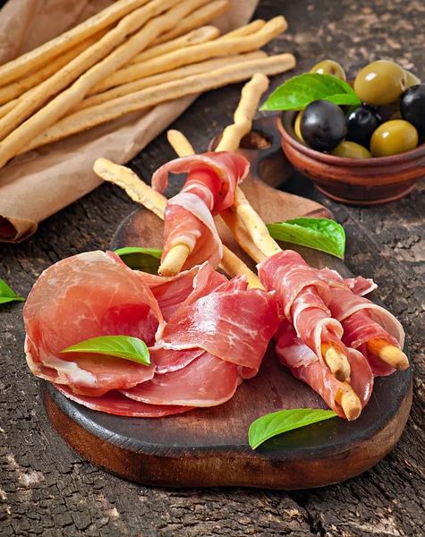 Grissini with ham — Stock Photo, Image