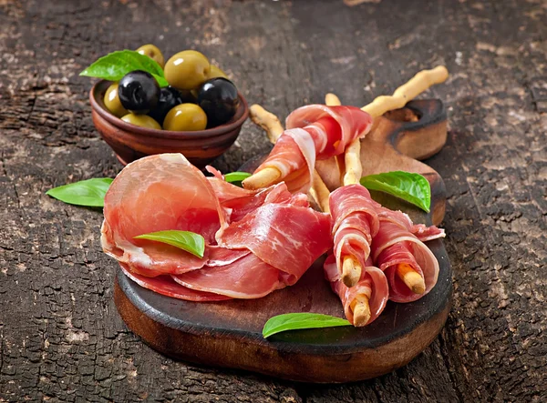 Grissini with ham — Stock Photo, Image