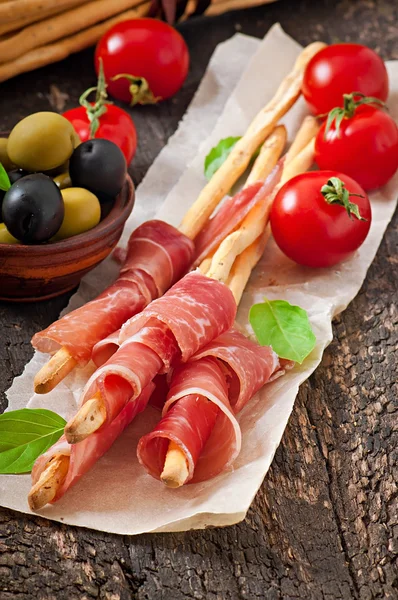 Grissini with ham — Stock Photo, Image