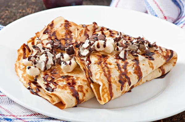 Pancakes with chocolate syrup — Stock Photo, Image