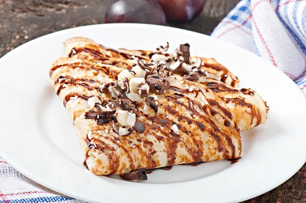 Pancakes with chocolate syrup — Stock Photo, Image