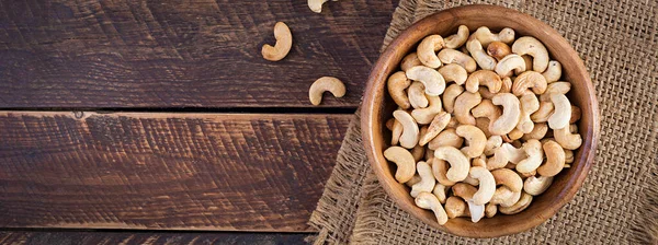 Tasty Cashew Nuts Bowl Wooden Table Top View Banner — Stok fotoğraf