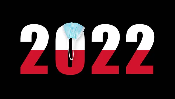 コヴィトからマスク中の数字2022の背景にポーランドの旗 — ストック写真