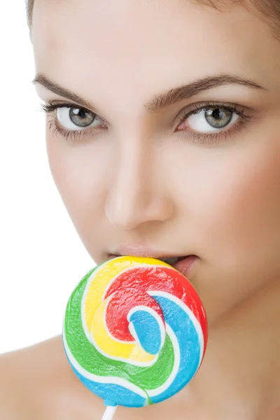 Young girl with a lollipop near her lips — Stock Photo, Image