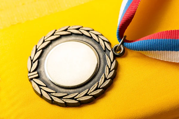 Metal medal with tricolor ribbon — Stock Photo, Image