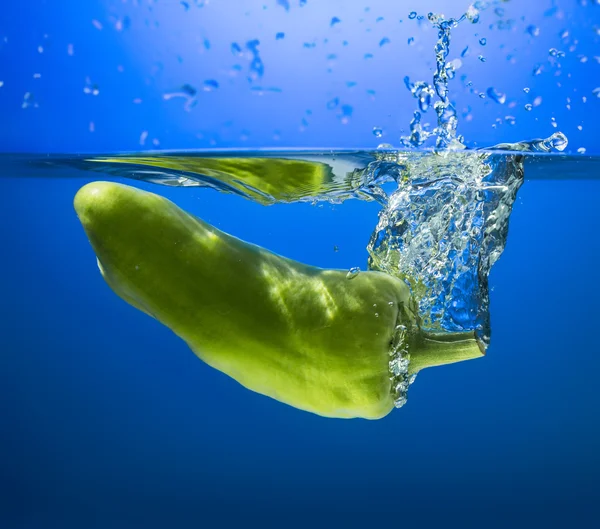 Fresh paprika in water splash — Stock Photo, Image