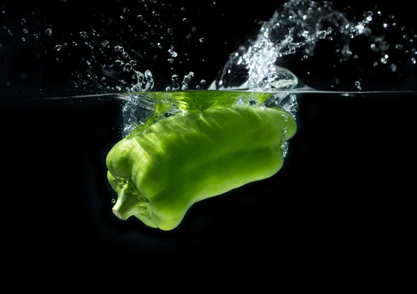 Fresh paprika in water splash — Stock Photo, Image