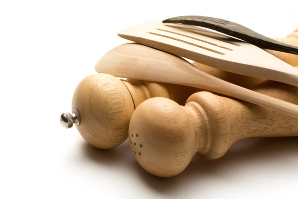 Wooden salt and pepper set with kitchen utensils — Stock Photo, Image