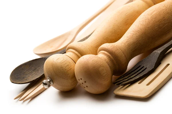 Wooden salt and pepper set with kitchen utensils — Stock Photo, Image