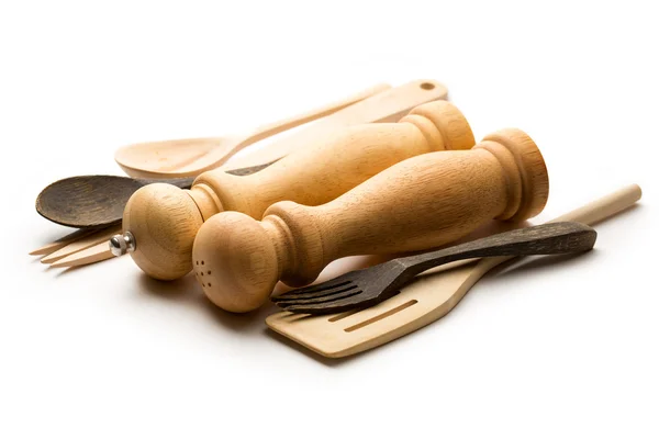 Wooden salt and pepper set with kitchen utensils — Stock Photo, Image