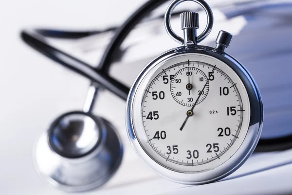 Pile of paper cards, stethoscope and stopwatch — Stock Photo, Image