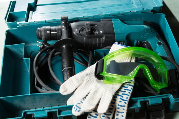 Drill and goggles in the box — Stock Photo, Image