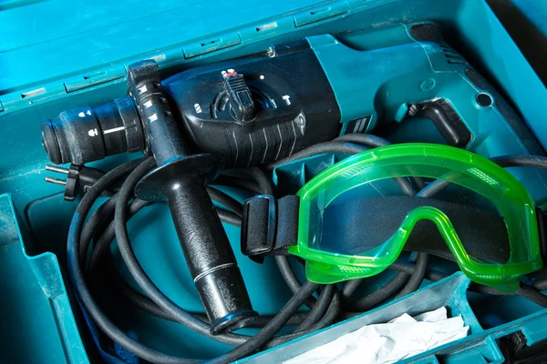 Drill and goggles in the box — Stock Photo, Image