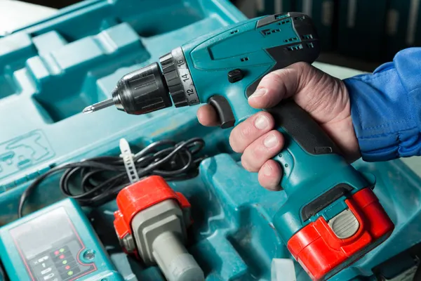 Male hand holding a screwdriver — Stock Photo, Image