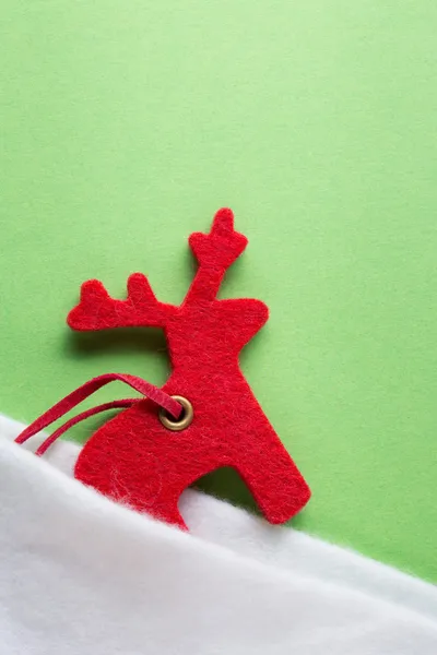 Santa sock with reindeer on green — Stock Photo, Image