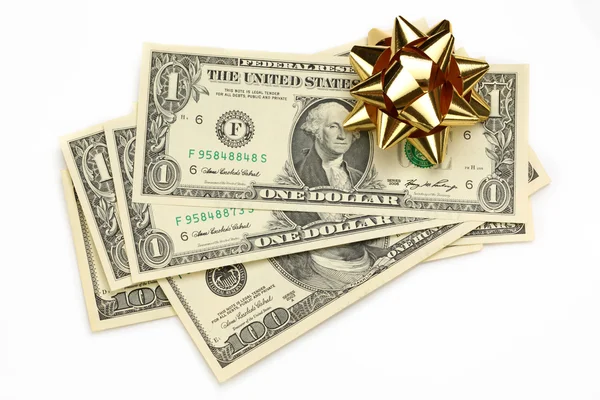 Dólares com arco decorativo em branco — Fotografia de Stock