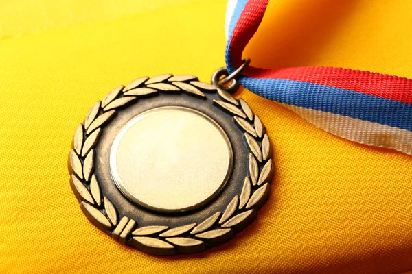 Metal medal with tricolor ribbon — Stock Photo, Image