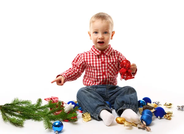 Köknar dalı ve Noel dekorasyonu ile çocuk — Stok fotoğraf