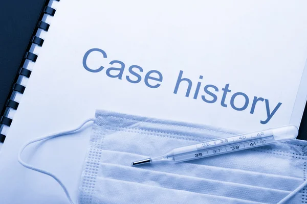 Case history, mask and thermometer on black — Stock Photo, Image