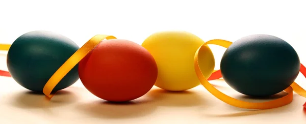 Easter eggs with yellow ribbon — Stock Photo, Image