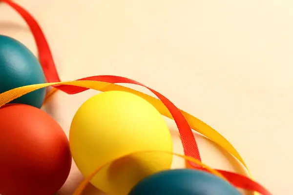 Easter eggs with yellow ribbon — Stock Photo, Image