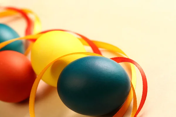 Easter eggs with yellow ribbon — Stock Photo, Image