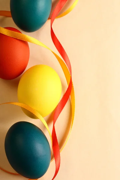 Easter eggs with yellow ribbon — Stock Photo, Image