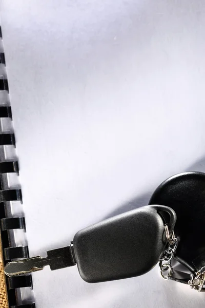 Blank notebook and car key — Stock Photo, Image