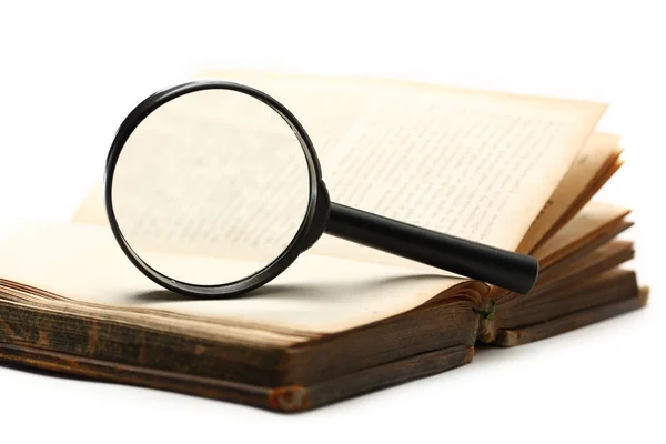 Magnifying glass and old book on the white background — Stock Photo, Image